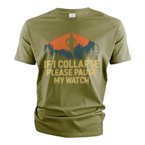 May include: Green short-sleeved t-shirt with a retro-style graphic of a runner in a mountain landscape. The text "IF I COLLAPSE PLEASE PAUSE MY WATCH" is printed in yellow on the shirt.