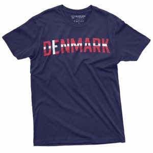May include: A navy blue t-shirt with the word "DENMARK" printed in white letters with a red and white flag design.