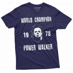 May include: A navy blue t-shirt with a white graphic of a hockey mask, the text "WORLD CHAMPION", "19 78", and "POWER WALKER".