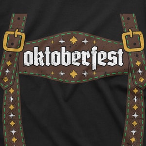 May include: A black t-shirt featuring a brown leather suspender design and the text "oktoberfest" in white.