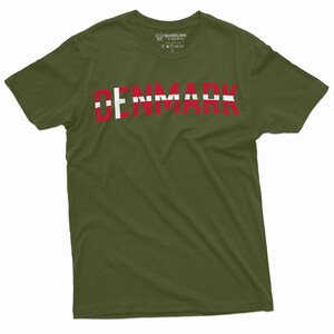 May include: A green t-shirt with the word "DENMARK" printed in red and white letters, resembling the Danish flag.