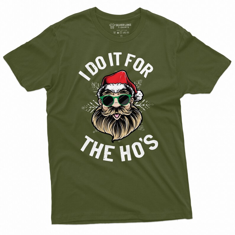 May include: Green t-shirt with a white graphic of Santa Claus wearing sunglasses and a beard. The text "I do it for the ho's" is printed below the image.