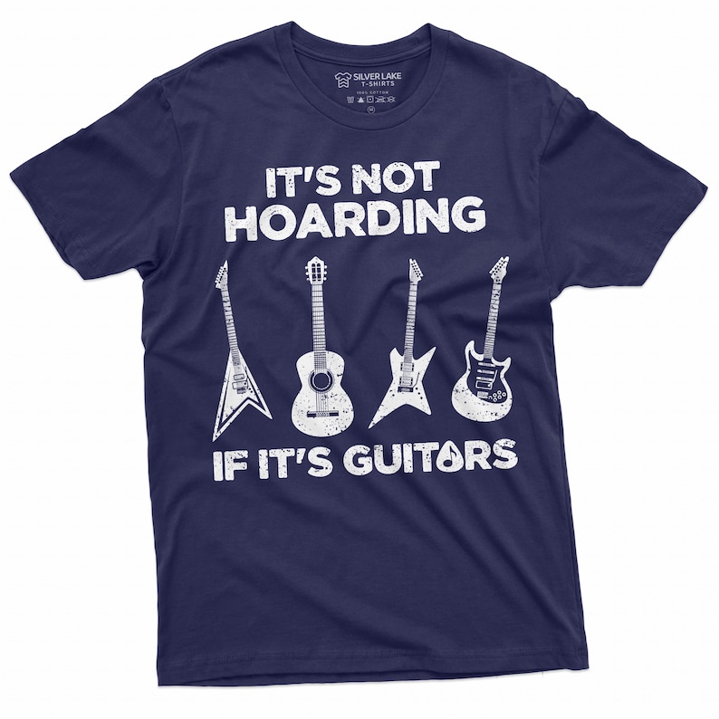 May include: Navy blue t-shirt with white text that reads "It's not hoarding if it's guitars". The shirt features a graphic of five guitars, including an acoustic guitar, an electric guitar, and a bass guitar.