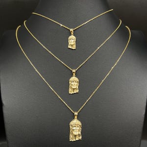 May include: A set of three ceramic mugs with a speckled, matte finish. The mugs are in shades of cream, light gray, and dark gray. Each mug has a simple, minimalist design and a rounded handle.