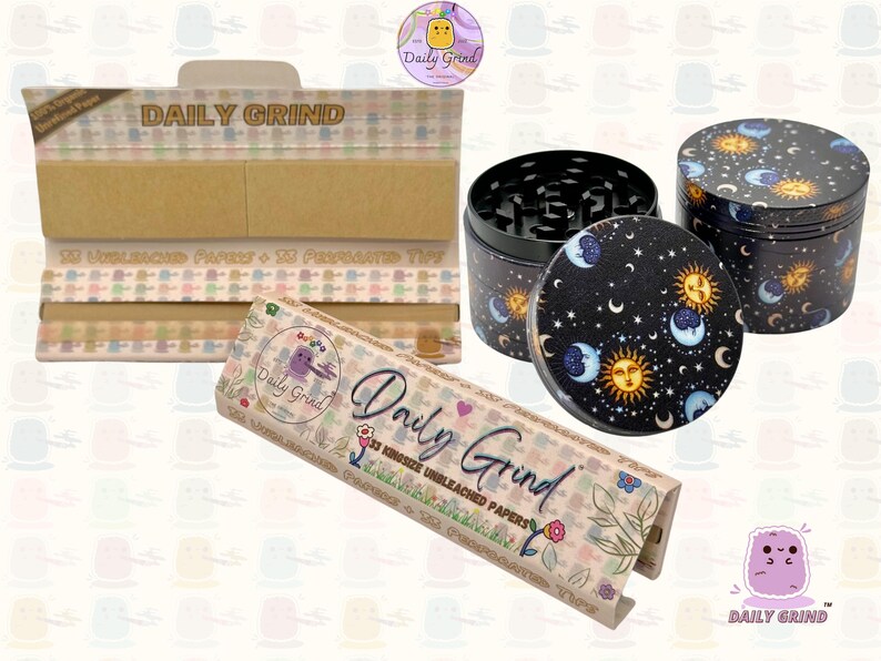 A light brown and beige box with the text 'Daily Grind' and ‘Kingsize Unbleached Papers' on it. The box is open and there are brown papers inside. There is a tobacco grinder with a cartoon sun and moon astrology design on it next to the box and The 'Daily Grind' logo is in the corner of the image