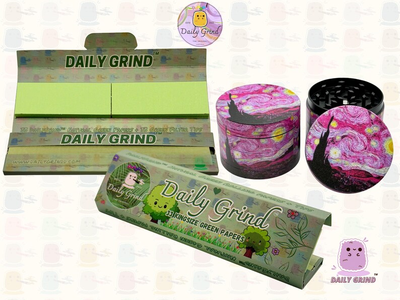 A dark Purple packet and a Green box with the text 'Daily Grind' on both and ‘Kingsize Purple Papers' on one and ‘Kingsize Green Papers’ on the other. Both boxes open showing green papers in one and purple in the other. There is a tobacco grinder with a classic pink piece of art underneath it and The 'Daily Grind' logo is in the corner of the image
