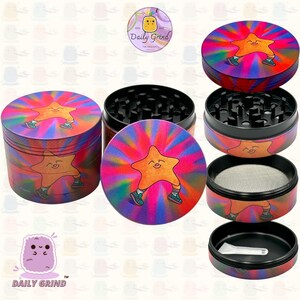A four piece Metal Tobacco Grinder with a colourful striking design disassembled and showing all the different layers, the top two contain the grinding teeth and the bottom two are for storage. The grinder features a star very happy in the middle of the image with a multi coloured explosion behind him. The inside of the grinder is black. The Daily Grind logo is visible in the corner of the image