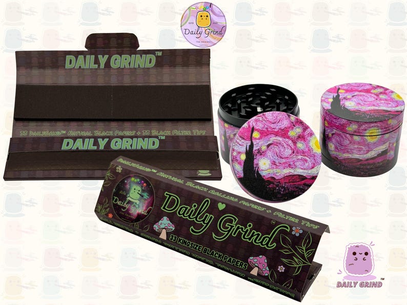 A black and green box with the text 'Daily Grind' and Kingsize Black Papers' on it. The box is open and there are black papers inside. There is a tobacco grinder next to the box with a pink star night design on it and the 'Daily Grind' logo is in the corner of the image