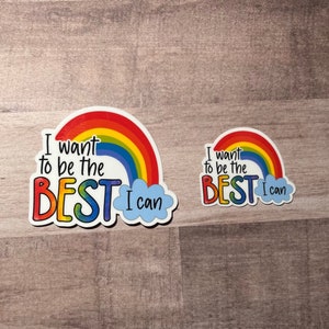 May include: Two rainbow stickers with the text "I want to be the BEST I can" in black lettering. The larger sticker has a blue cloud with the text "I can" in white lettering.