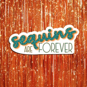 May include: A white sticker with the teal text "Sequins are Forever" in a glittery font. The sticker is set against a background of orange, glittery, vertical strands.