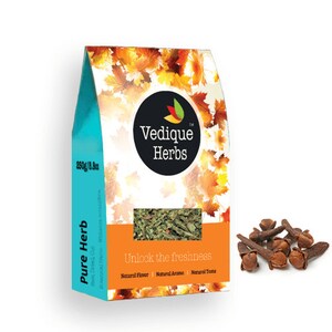 May include: A package of Vedique Herbs, with a teal and orange design, featuring the text "Pure Herb" and "Unlock the freshness." The package contains 250g/8.8oz of herbs. Beside the package are several brown cloves.