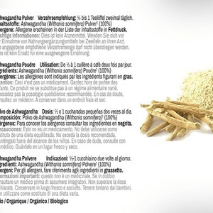 May include: Ashwagandha powder in a white container with a pile of dried roots. The label is in German, French, Spanish, and Italian. The text on the label includes the ingredients, dosage, and warnings. The product is organic.