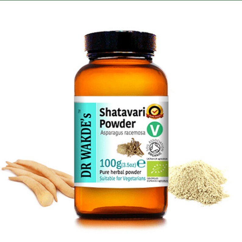 May include: A brown glass bottle with a white label that reads "DR WAKDE'S Shatavari Powder Asparagus racemosa 100g(3.5oz) e Pure herbal powder Suitable for Vegetarians". The bottle has a green and white sticker with a green leaf and the text "Soil Association Organic".