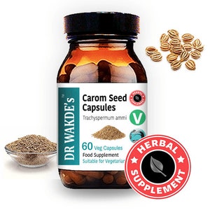 Puede incluir: Una botella de vidrio marrón con una tapa negra etiquetada con "DR WAKDE'S" y "Carom Seed Capsules". La botella contiene 60 cápsulas vegetarianas y es un suplemento alimenticio. La etiqueta también indica "Trachyspermum ammi" y "Apta para vegetarianos". Un círculo rojo y blanco con una hoja verde y el texto "HERBAL SUPPLEMENT" está en primer plano.
