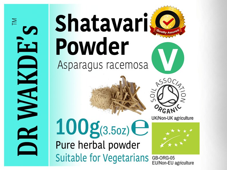 May include: A green and white label with the text "DR WAKDE'S" in black, "Shatavari Powder" in black, "Asparagus racemosa" in black, "100g (3.5oz) e" in black, "Pure herbal powder" in black, and "Suitable for Vegetarians" in black. The label also features a green "V" with "SOIL ASSOCIATION ORGANIC" in black and "UK/Non-UK agriculture" in black. There is a green label with a white star and a green stem with the text "GB-ORG-05 EU/Non-EU agriculture" in black. There is a yellow and red label with a checkmark and the text "Quality Assured" in black.