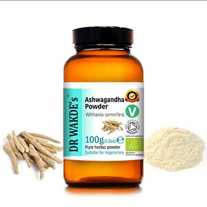 May include: A brown glass bottle with a white label that reads "Dr. Wakde's Ashwagandha Powder Withania somnifera 100g (3.5oz) e Pure herbal powder Suitable for Vegetarians". The bottle is surrounded by dried roots and a pile of light brown powder.