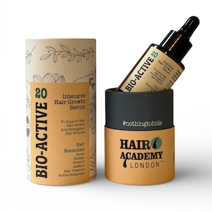 May include: A hair growth serum product with a dropper bottle and two cylindrical containers. The containers are tan and black with the words "BIO-ACTIVE" and "HAIR ACADEMY LONDON" printed on them. The serum bottle is brown with a black dropper.