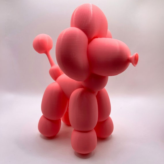 A handmade balloon-dog-style ornament with 130 favorites backing it up — playful Koons-inspired pop art aesthetic at an impulse-buy price.