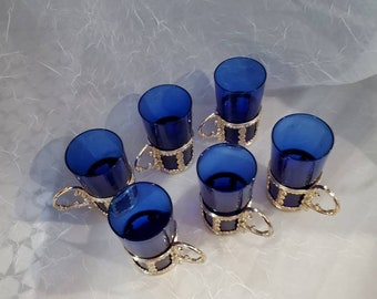 Six vintage cobalt blue Aperitif glasses in silver tone metal casings.