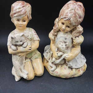 For the love of cats. A very old mold, maker unknown. I have seen this made in a variety of materials. Always with a pet. Always adorable.