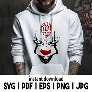 Puede incluir: Sudadera blanca con una ilustraci&oacute;n roja y negra de una cara de payaso con el texto "You'll Float Too" en la parte delantera.