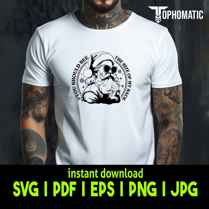 May include: A white t-shirt with a black and white graphic of Santa Claus wearing sunglasses and a Santa hat. The graphic is in a circle with the text "You should see the size of my sack" around it.