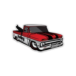 May include: A red and white vintage pickup truck with black racing stripes on the hood. The truck has a surfboard in the bed and the word "Holley" printed on the side.