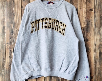 Bluza męska Pittsburgh marki Champion w stylu vintage, z okrągłym dekoltem i haftowanym logo w kolorze szarym, rozmiar M