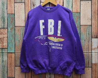 Vintage des années 90 en détresse sweat du FBI col rond du FBI pull FBI pull Fbi pull Fbi imprimé logo couleur pourpre homme coupe M