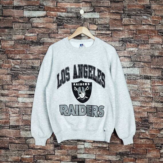 Vintage 90s Distressed Oakland Raiders Football by Russell