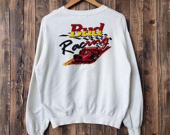 May include: White sweatshirt with a Bud Racing logo featuring a red race car and checkered flag design.