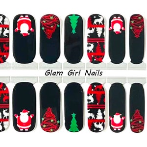 May include: Set of 10 Christmas nail wraps featuring a red and white sweater pattern, Santa Claus, a Christmas tree, and the text "Glam Girl Nails".