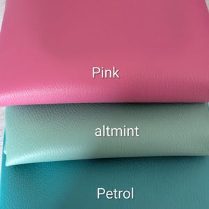 May include: Three fabric swatches in pink, altmint, and petrol. The pink swatch is at the top, followed by altmint, and petrol at the bottom. Each swatch has a label with its colour name.