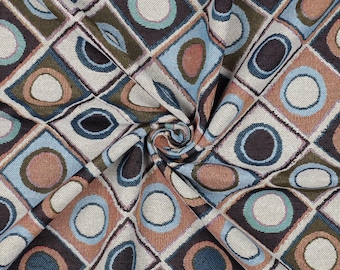 May include: A fabric with a geometric pattern of squares and circles in shades of brown, blue, green, and white.