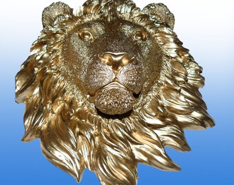 Gold-colored large lion head made of high-quality plaster