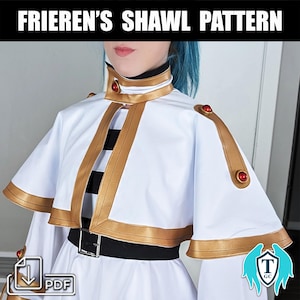 Puede incluir: Un patrón de chal blanco con ribetes dorados y botones rojos. El patrón incluye un cuello, hombreras y un cinturón. El patrón está disponible para descargar en PDF.