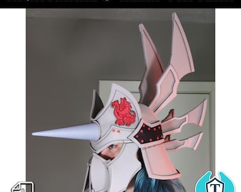 May include: A white and grey helmet with a red dragon design and a long, pointed horn. The helmet is being worn by a person with blue hair. The text "NIGHTMARE'S HELM PATTERN" is at the top of the image. The text "PDF" is at the bottom of the image.
