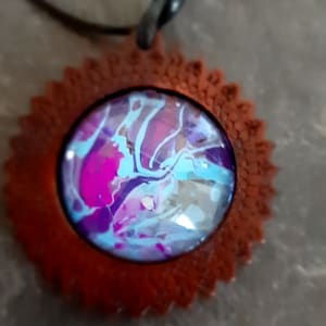 1 necklace pendant in wood decorated with a cabochon with leather strap
