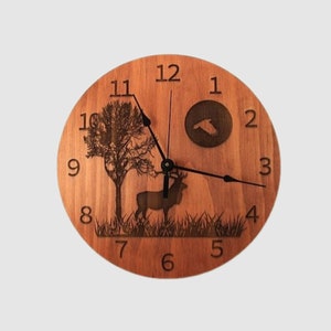May include: A wooden clock with a deer, a tree, and a bird silhouette design. The clock face has black hands and Roman numeral markings.