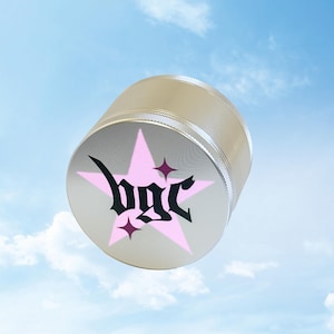 May include: Silver grinder with a pink star and the text "bgc" in black lettering. The star has two small pink diamonds on it.