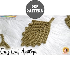 May include: A crochet leaf applique in a muted olive green color with a textured, ribbed stitch pattern. The image includes the text PDF PATTERN, Creggy's Crochet, and Easy Leaf Applique. The design features a pointed tip and serrated edges.