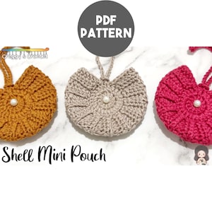 May include: Three crocheted shell mini pouches in mustard yellow, beige, and magenta. Each circular pouch features a central white pearl bead and a matching crocheted loop handle. The image includes the text PDF PATTERN and Shell Mini Pouch.
