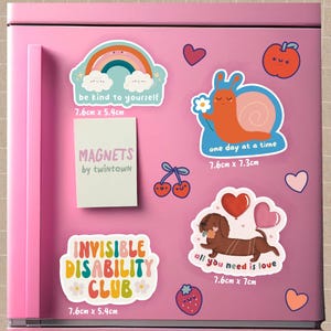 May include: A set of 7 fridge magnets with colourful illustrations and positive messages. The magnets feature a rainbow, a snail, a dachshund, a heart, cherries, and strawberries. The magnets are 7.6 cm by 5.4 cm or 7.6 cm by 7 cm.