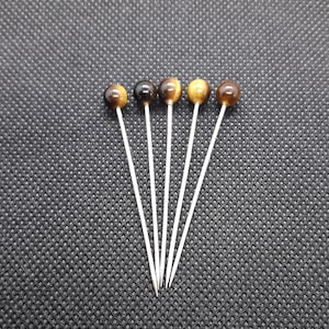 A giving pin, cloth pin, headscarf pin, Middle Ages, garment, tiger&#39;s eye