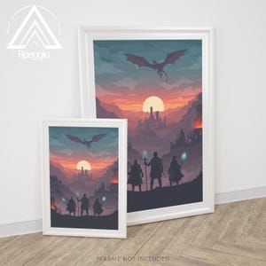May include: Two framed art prints with a fantasy landscape scene. The artwork depicts a dragon flying over a castle at sunset, with figures in the foreground. The prints are in white frames and are displayed on a wooden floor.