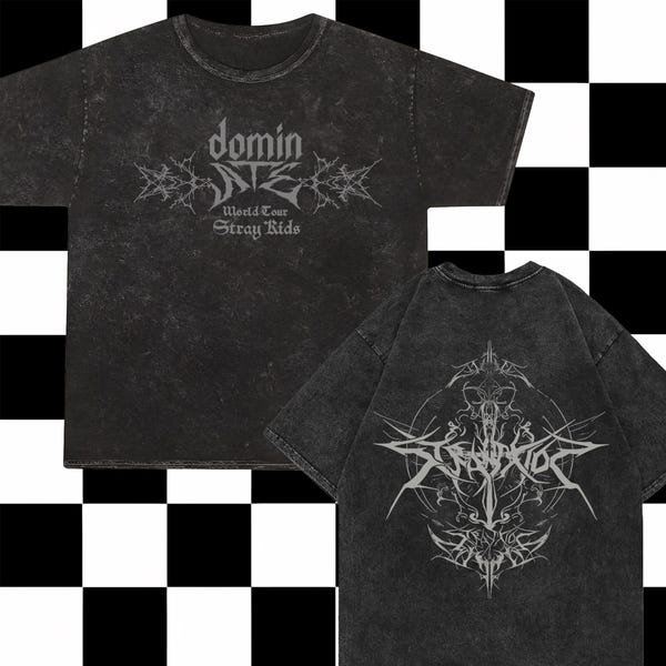 May include: Two black t-shirts with a distressed, vintage look. The front of one shirt features the text "domin Stray Kids World Tour" in a gothic font. The back of the other shirt features a graphic design of a skull with a sword and the text "Stray Kids" in a gothic font.
