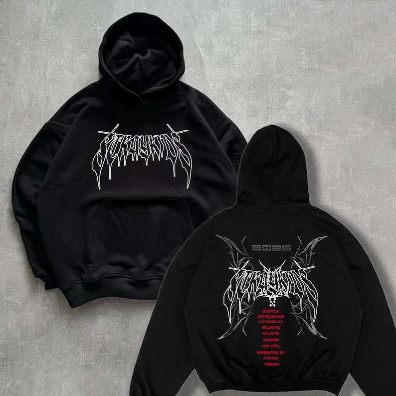 May include: Black hooded sweatshirt with a white graphic print of the text "SURVIVORS" on the front and a white graphic print of the text "SURVIVORS" with a date "2023" and a list of cities on the back.