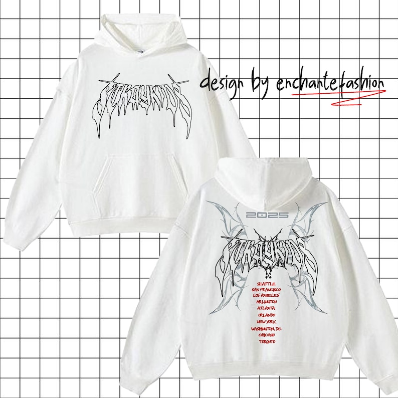May include: White hooded sweatshirt with a black graphic print of the word "SURROUNDS" in a gothic font. The back of the sweatshirt has the same graphic print with the year "2025" above it and a list of cities in a smaller font below it.