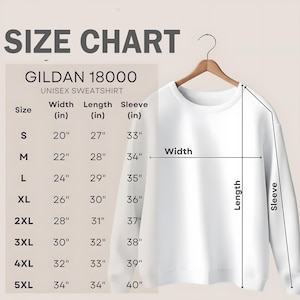 Może przedstawiać: Tabela rozmiar&oacute;w dla unisexowej bluzy Gildan 18000. Tabela pokazuje szerokość, długość i długość rękawa w calach dla rozmiar&oacute;w od S do 5XL.