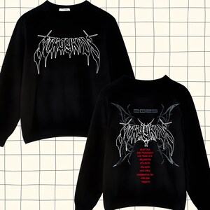 May include: Black long-sleeve sweatshirt with a white graphic print of the word "FURY" in a gothic font. The back of the sweatshirt has the same graphic with the year "2025" above it and a list of cities in red text.